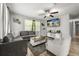 Bright living room with modern furniture, wood floors, and a large TV at 600 Plum Ln, Altamonte Springs, FL 32701