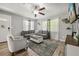 Cozy living room with wood flooring, comfortable seating, and natural light at 600 Plum Ln, Altamonte Springs, FL 32701