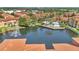 Aerial view of a pool, lake, and clubhouse for residents to enjoy in this community at 6149 Metrowest Blvd # 103, Orlando, FL 32835