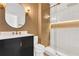 Stylish bathroom showcasing a modern vanity, lighting, and glass-enclosed shower at 6149 Metrowest Blvd # 103, Orlando, FL 32835