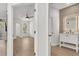 View of the bedroom and bathroom with modern finishes and light wood floors at 6149 Metrowest Blvd # 103, Orlando, FL 32835