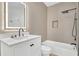 Modern bathroom featuring a sleek vanity, illuminated mirror, bathtub, and a rainfall shower head at 6149 Metrowest Blvd # 103, Orlando, FL 32835
