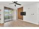 Bedroom showcasing light-colored floors and natural light from a sliding glass door at 6149 Metrowest Blvd # 103, Orlando, FL 32835