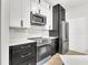 Modern kitchen showcasing white countertops, a black cooktop, and stainless steel appliances at 6149 Metrowest Blvd # 103, Orlando, FL 32835