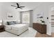 Serene bedroom featuring neutral tones, a ceiling fan, and lots of natural light at 6149 Metrowest Blvd # 103, Orlando, FL 32835