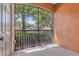 Private screened patio area overlooking a playground with lush greenery at 6149 Metrowest Blvd # 103, Orlando, FL 32835