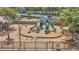 Fully fenced in playground with slides and picnic tables for residents to enjoy at 6149 Metrowest Blvd # 103, Orlando, FL 32835