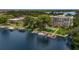 Aerial view of the waterfront community with boat docks, lush landscaping, and building exterior at 690 Osceola Ave # 410, Winter Park, FL 32789