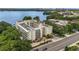 Aerial view of the property showcasing its prime waterfront location and building exterior at 690 Osceola Ave # 410, Winter Park, FL 32789