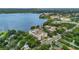 Stunning aerial view of a lakeside condo building with city skyline in the distance at 690 Osceola Ave # 410, Winter Park, FL 32789
