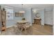 Cozy dining area with modern lighting and neutral tones, open to kitchen at 690 Osceola Ave # 410, Winter Park, FL 32789
