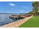 Waterfront dock with multiple boat slips, perfect for boating enthusiasts and enjoying lake views at 690 Osceola Ave # 410, Winter Park, FL 32789