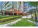 A stylish condo building with a well-manicured lawn and convenient covered parking at 690 Osceola Ave # 410, Winter Park, FL 32789