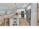 Bright kitchen boasts stainless steel appliances, granite countertops, and a breakfast bar overlooking the adjacent living area at 690 Osceola Ave # 410, Winter Park, FL 32789