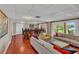 Spacious living room with ample seating and outdoor views of the yard at 690 Osceola Ave # 410, Winter Park, FL 32789