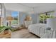 Bright bedroom with a king bed, ensuite, and plenty of natural light at 690 Osceola Ave # 410, Winter Park, FL 32789