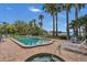 Inviting community pool and spa surrounded by lush landscaping and comfortable lounge chairs at 690 Osceola Ave # 410, Winter Park, FL 32789