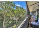 Relaxing screened porch with comfortable seating and views of the lush foliage at 690 Osceola Ave # 410, Winter Park, FL 32789