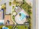 Aerial view of community amenities featuring a pool, playground, lounge area and parking at 7613 Wandering Way, Orlando, FL 32836