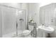 Modern bathroom featuring a glass-enclosed shower, sleek fixtures, and contemporary design at 7613 Wandering Way, Orlando, FL 32836