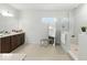 Spacious bathroom boasts double vanity, walk-in shower, and neutral tones at 7613 Wandering Way, Orlando, FL 32836