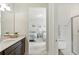 This home features a bathroom showcasing double sinks and opens into a bedroom at 7613 Wandering Way, Orlando, FL 32836