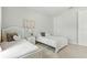Bright bedroom featuring two twin beds, soft decor, and a cozy, welcoming atmosphere at 7613 Wandering Way, Orlando, FL 32836