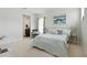 Spacious bedroom boasting soft tones, natural light, and a cozy chair for relaxation at 7613 Wandering Way, Orlando, FL 32836