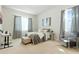 Bright bedroom with a comfy bed, stylish furniture, and soft natural light coming in through large windows at 7613 Wandering Way, Orlando, FL 32836
