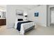 Cozy bedroom with neutral tones, art, and comfortable bedding, perfect for relaxation at 7613 Wandering Way, Orlando, FL 32836