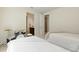 Well-lit bedroom featuring twin beds, a drum set, and an open bathroom at 7613 Wandering Way, Orlando, FL 32836