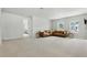 Spacious bonus room with a comfortable leather sectional sofa, creating a perfect relaxing space at 7613 Wandering Way, Orlando, FL 32836
