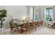 Bright dining room featuring a large table with seating for eight at 7613 Wandering Way, Orlando, FL 32836