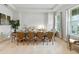 Elegant dining room with neutral colors and seating for eight at 7613 Wandering Way, Orlando, FL 32836