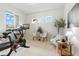 Bright and airy exercise room with workout equipment and a view at 7613 Wandering Way, Orlando, FL 32836