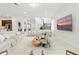Bright living room with stylish furniture, a modern staircase, and neutral decor at 7613 Wandering Way, Orlando, FL 32836