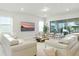 Spacious living room with plush seating and a sliding glass door to the backyard at 7613 Wandering Way, Orlando, FL 32836