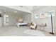 Bright main bedroom boasts tray ceiling, seating area, and ample space at 7613 Wandering Way, Orlando, FL 32836
