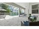 Covered patio features comfortable seating areas and offers views of the pool at 7613 Wandering Way, Orlando, FL 32836