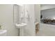 Modern powder room with a pedestal sink and clean lines at 7613 Wandering Way, Orlando, FL 32836
