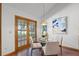 Breakfast nook featuring a glass table, seating for four, and natural light from the patio doors at 8665 Vista Point Cv, Orlando, FL 32836