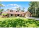 Charming single-story home with manicured lawn and inviting entrance, offering great curb appeal at 8665 Vista Point Cv, Orlando, FL 32836