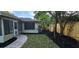 Cozy backyard with new landscaping, green grass, and wood privacy fence at 917 Great Bend Rd, Altamonte Springs, FL 32714