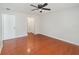 Spacious bedroom with ceiling fan and rich wood-look floors at 917 Great Bend Rd, Altamonte Springs, FL 32714