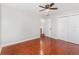 Spacious bedroom features closet, ceiling fan, and rich wood-look floors at 917 Great Bend Rd, Altamonte Springs, FL 32714