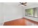 Bedroom featuring wood-look floors, ceiling fan, and a large window at 917 Great Bend Rd, Altamonte Springs, FL 32714