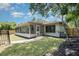 Exterior view of home, with screened porch and fenced backyard at 917 Great Bend Rd, Altamonte Springs, FL 32714