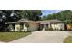 Lovely home with well-manicured lawn, mature landscaping, and attached garage at 917 Great Bend Rd, Altamonte Springs, FL 32714