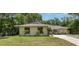 Inviting single-story home with a well-manicured lawn and beautiful landscaping, creating a warm and welcoming curb appeal at 917 Great Bend Rd, Altamonte Springs, FL 32714