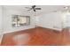 Spacious living room with wood floors, neutral walls, and large window, creating a welcoming and comfortable atmosphere at 917 Great Bend Rd, Altamonte Springs, FL 32714